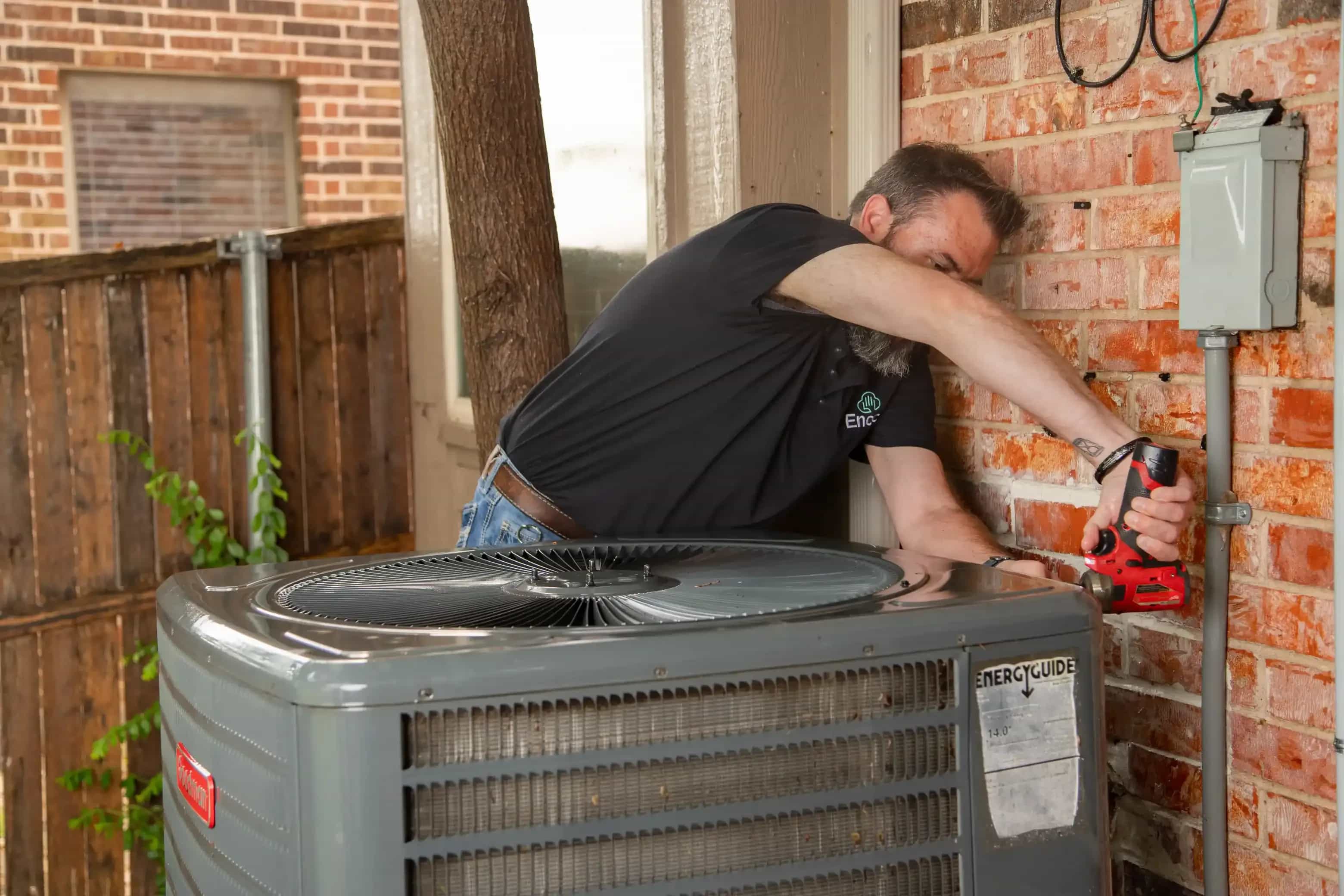 HAVC technician installing new heat pump
