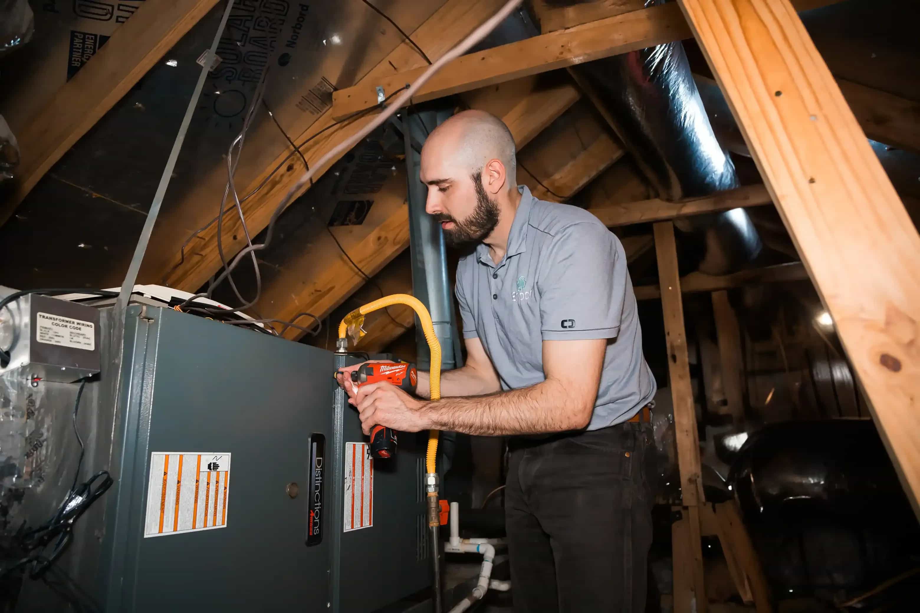 technician repairing gas furnace