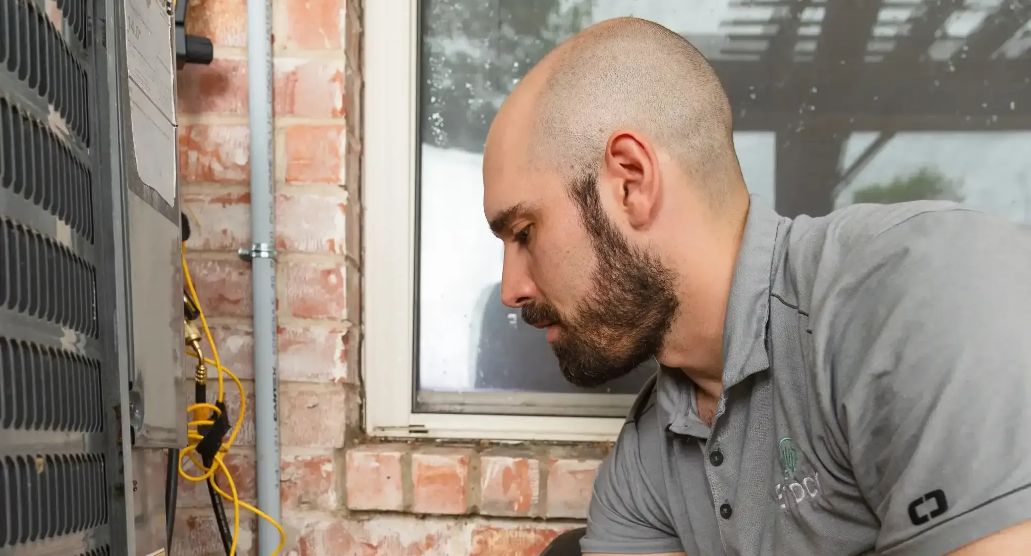 HAVC technician checking heat pump