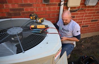 An HVAC contractor installing a new HVAC system
