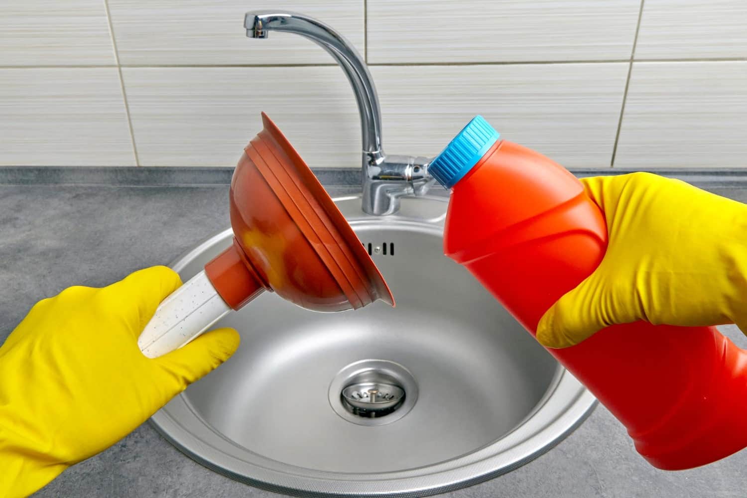 hands-yellow-rubber-gloves-hold-plunger-pipe-cleaner-against-background-kitchen-sink