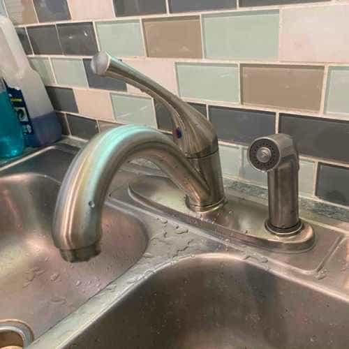 male-plumber-uniform-fixing-faucet-kitchen-handyman-with-toolbag-repair-sink-sanitary-equipment-service-home