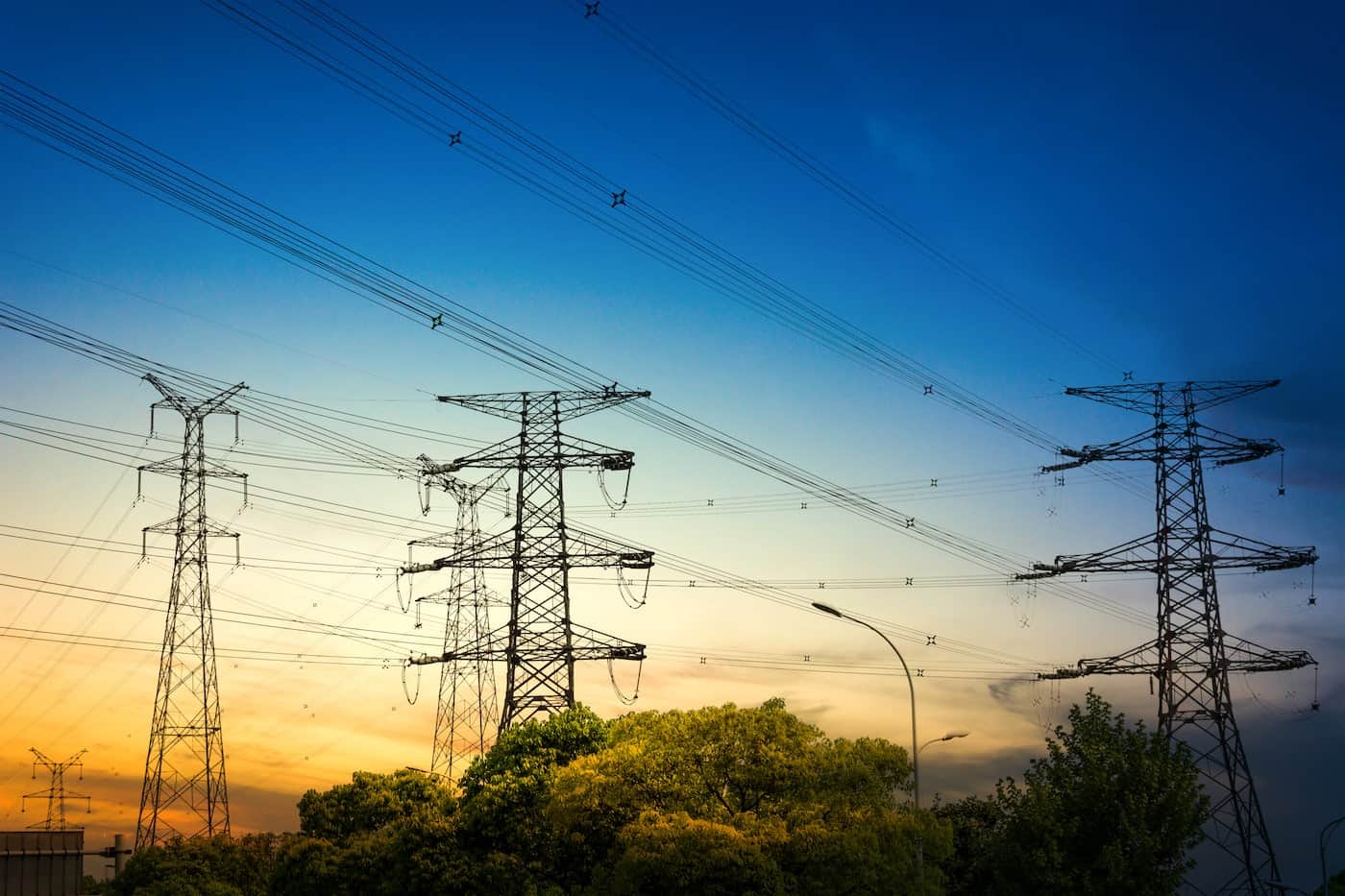 sun-setting-silhouette-electricity-pylons