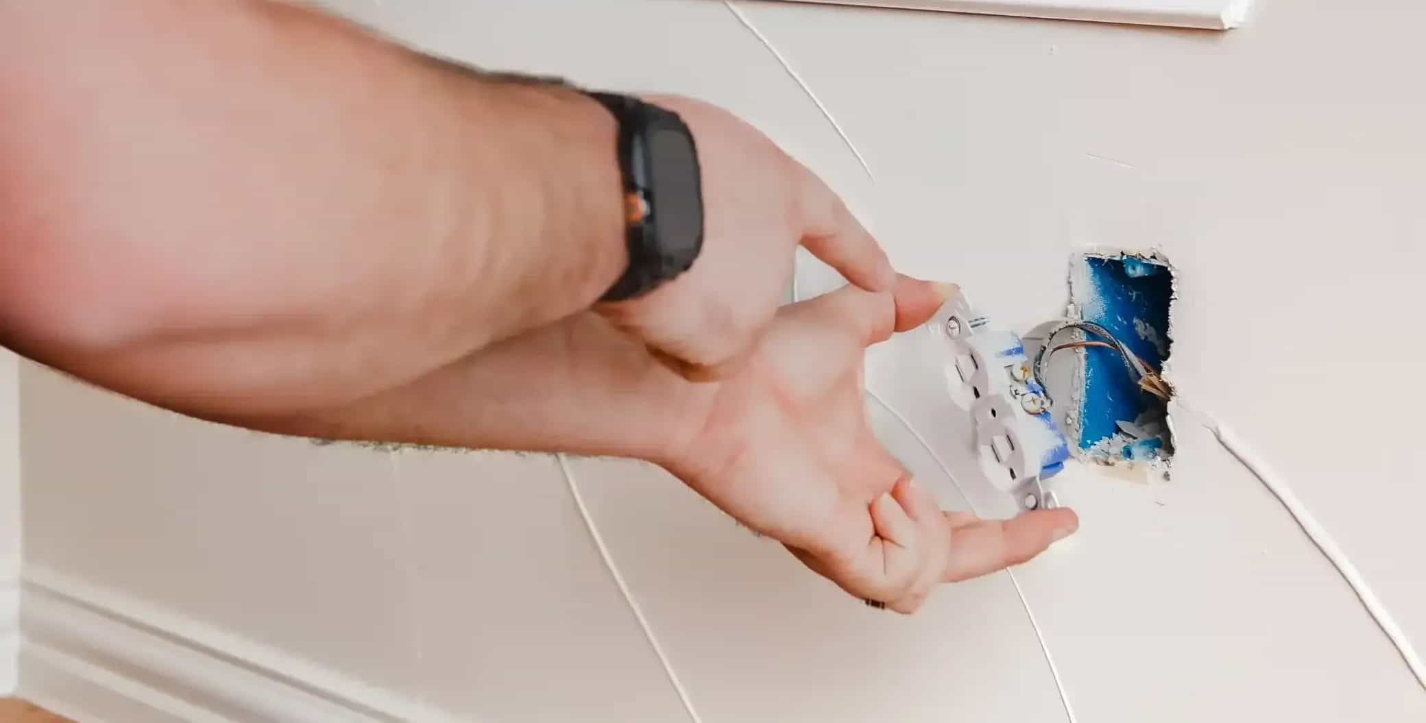 team enoch technician installing electric switch