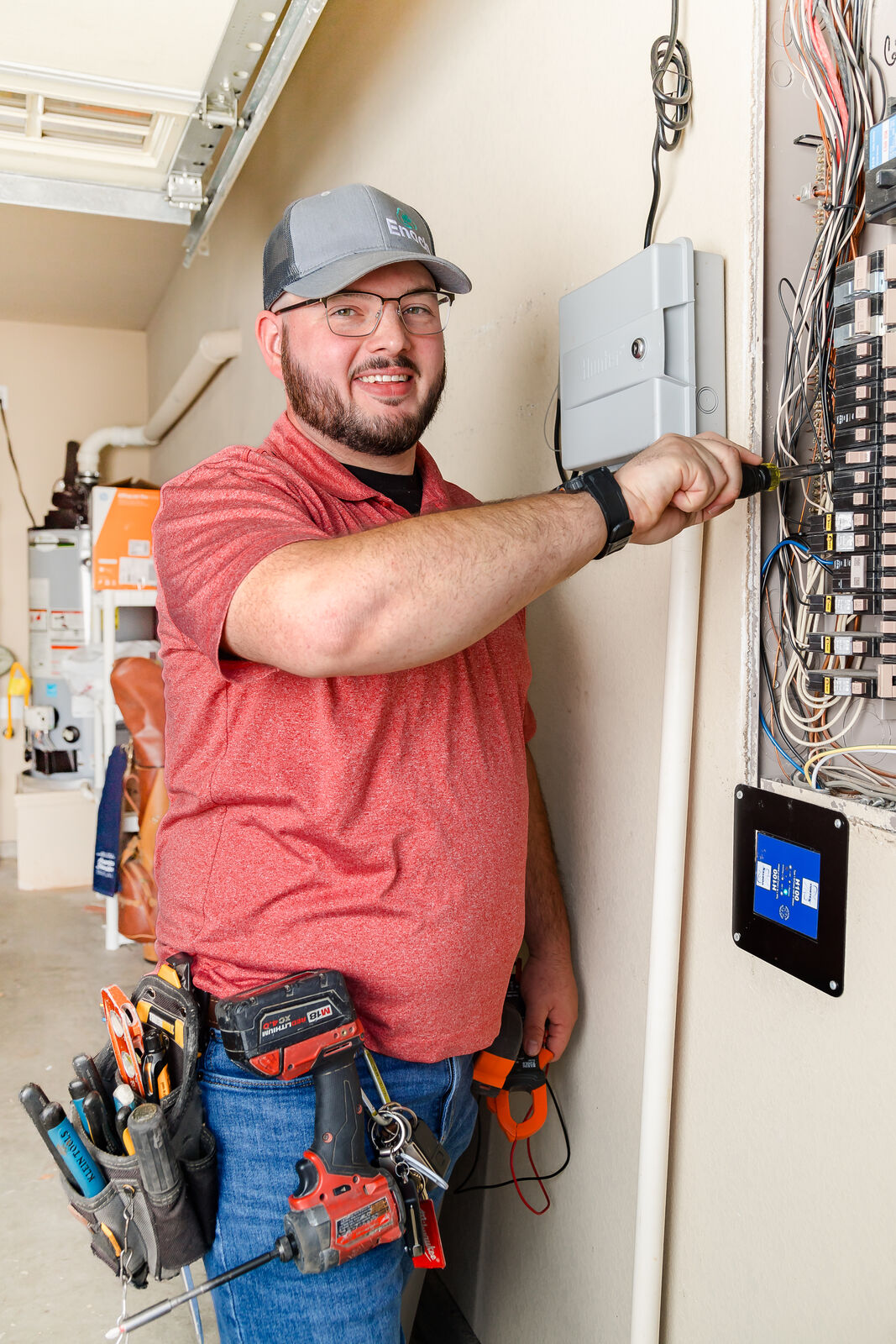 Team Enoch technician performing HVAC system maintenance
